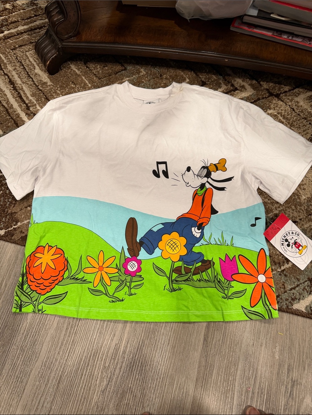 Disney White Tee with Goofy and Colorful Floral Scene